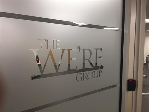 the were group   melville   jericho   lake success   westbury ny etched frosted glass logo knocked out
